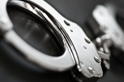 enhanced photo of silver handcuffs