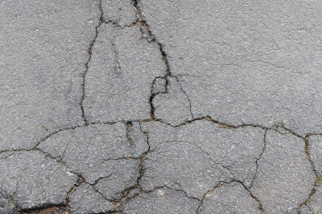 hazardous cracks in the road's asphalt