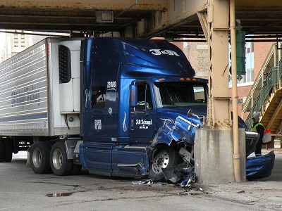 blue semi-truck crashed into wall