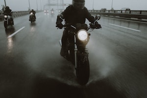 motorcyclist driving in risky conditions