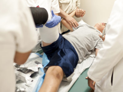 injured victim receiving E.R. medical help